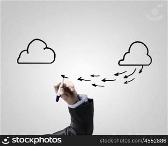 Wireless connection. Close up of male hand drawing cloud computing concept