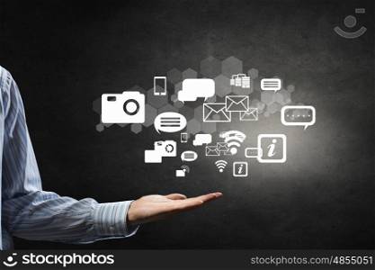 Wireless connection concept. Businessman hand holding cloud computing concept in palm