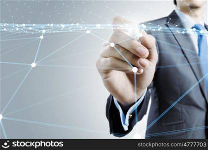 Wireless connection futuristic concept. Businessman hand drawing digital connection lines on virtual screen