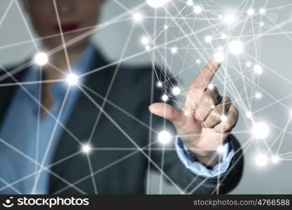 Wireless connection futuristic concept. Businesswoman hand touching with finger digital connection lines on virtual screen