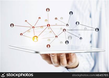 Wireless connection technologies. Hand of man holding tablet representing social networking concept
