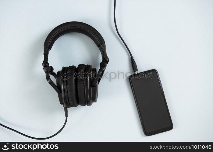 Wireless headphones on white background. Wireless headphones with smartphone on white background