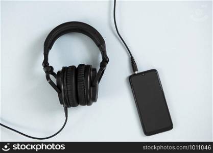Wireless headphones on white background. Wireless headphones with smartphone on white background