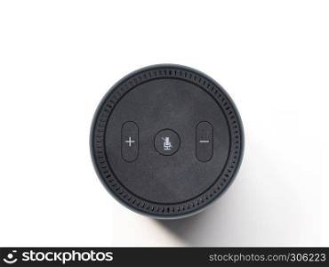 Wireless speaker, voice assistant device on plain white background, top view.