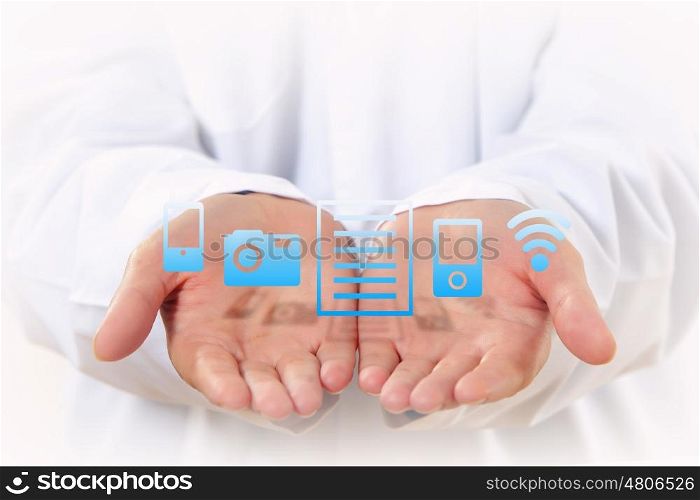 Wireless technologies. Close up of human hands with device icons