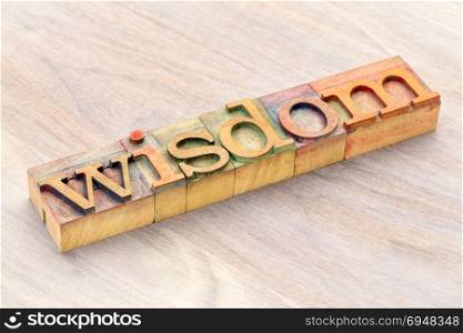 wisdom word abstract in letterprtess wood type blocks stained by color inks