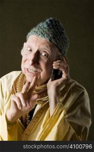Wise Man with Knit Cap Talking on Cell Phone