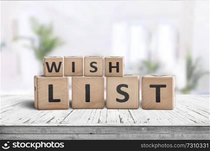 Wish list sign made of wooden blocks on a desk in a bright living toom
