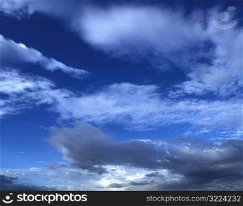 Wispy Dark Clouds Streaking Through A Blue Sky