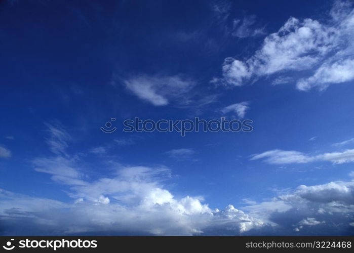 Wispy White Clouds In A Blue Sky