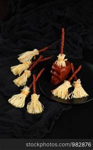 Witches Broom of smoked cheese suluguni and salami. Original idea Halloween snack.