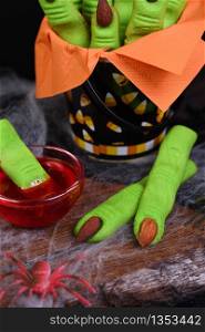 Witches Finger cookies made of shortcrust pastry with almond fingernail. Ideally for a Happy Halloween party