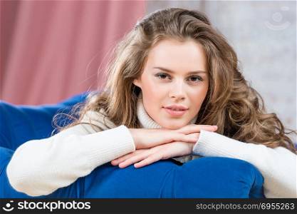 with a beautiful smile girl in a warm sweater horizontal portrait