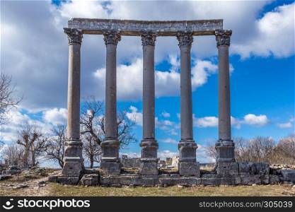 With blue sky,Marble columns of Temple of Tyche, goddess of fortune, Roman, late first century AD, Olba, (Uzuncaburc),Mersin,Turkey. Temple of Tyche, goddess of fortune, Roman in Uzuncaburc