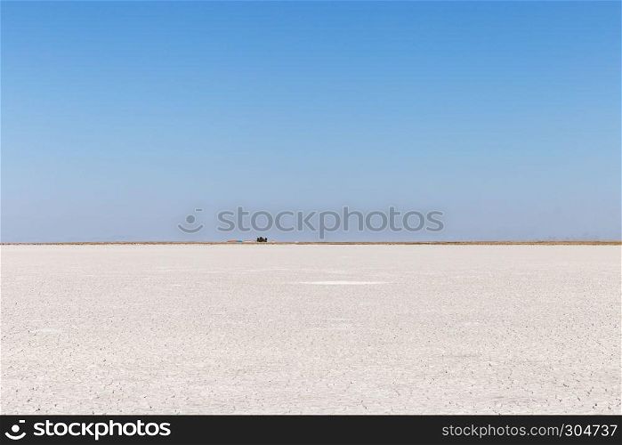 With clean blue sky,Panoramic landscape view of salt lake, located in Central Anatolia, Aksaray,Turkey.Copy space for editing.. Panoramic landscape view of salt lake in Aksaray,Turkey.