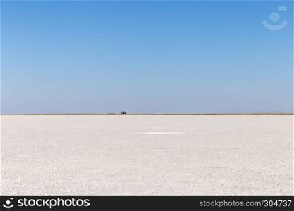 With clean blue sky,Panoramic landscape view of salt lake, located in Central Anatolia, Aksaray,Turkey.Copy space for editing.. Panoramic landscape view of salt lake in Aksaray,Turkey.