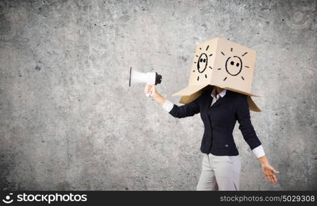 With mask on face. Conceptual image of businesswoman with carton box on head