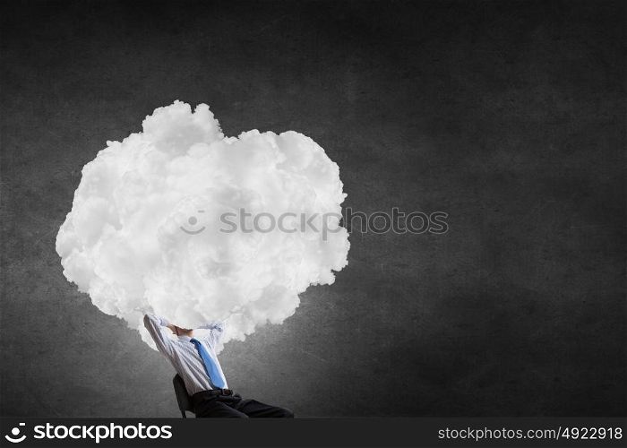 With one&rsquo;s head in clouds. Businessman sitting in chair with cloud instead of head