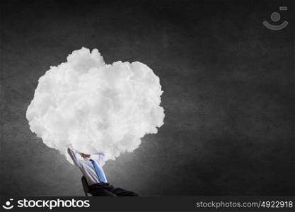 With one&rsquo;s head in clouds. Businessman sitting in chair with cloud instead of head