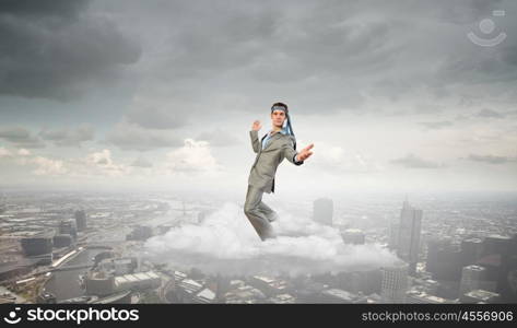 With tie on head. Cheerful young businessman with tie around head