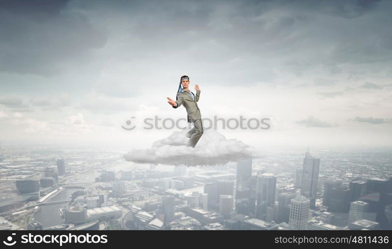 With tie on head. Cheerful young businessman with tie around head