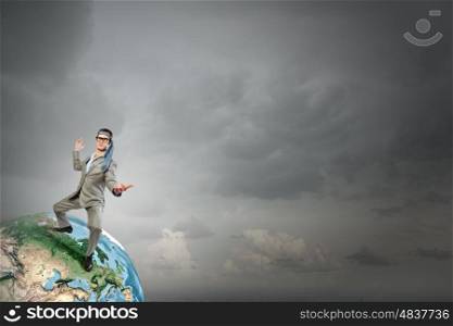 With tie on head. Cheerful young businessman with tie around head. Elements of this image are furnished by NASA