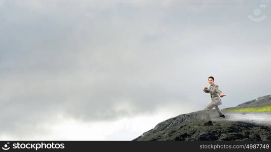 With tie on head. Cheerful young businessman with tie around head