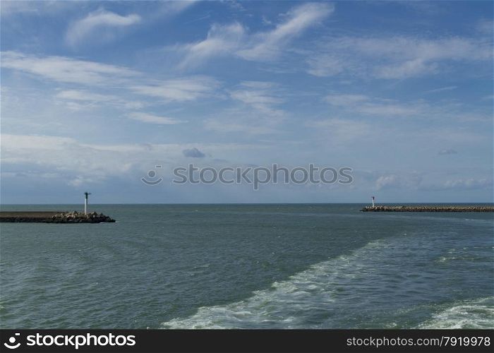 With wash from ferry, entrance to Dunkirk Harbor, France, Europe.