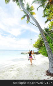 Womain in beach hammock