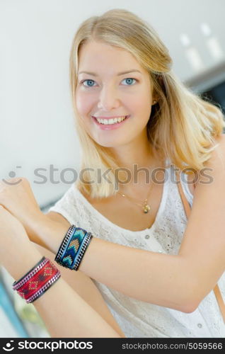 Woman about to buy some colourful bracelets