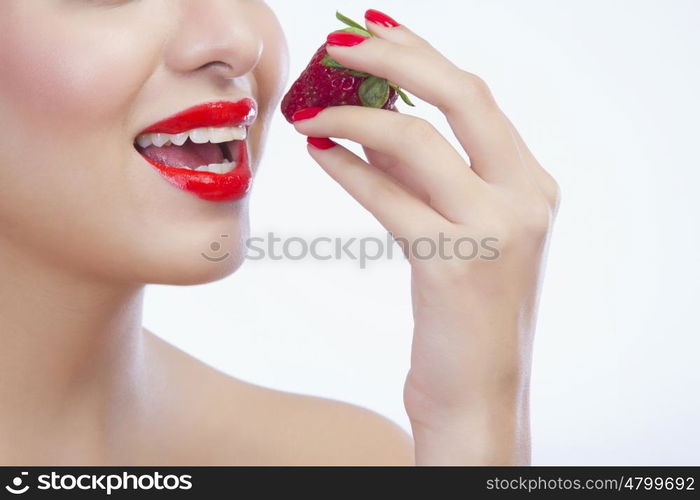 Woman about to eat a strawberry