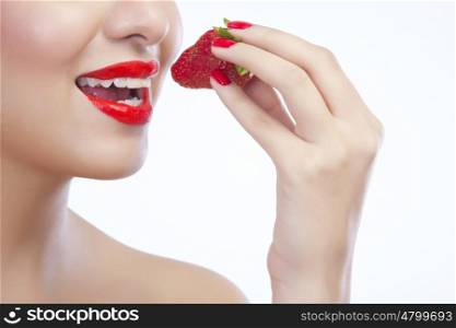 Woman about to eat a strawberry
