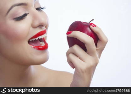 Woman about to eat an apple