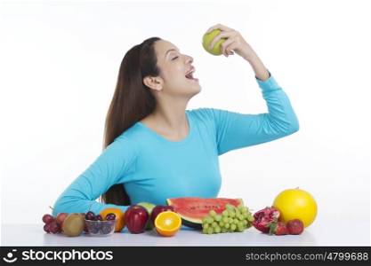 Woman about to eat an apple