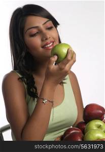Woman about to eat an apple