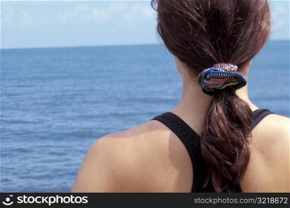 Woman About to Go Swimming in the Ocean