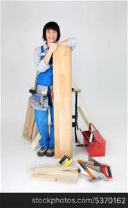 Woman about to lay laminate flooring
