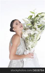 Woman accepts a bouquet of white flowers