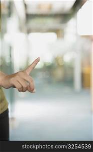 Woman&acute;s finger pointing upwards