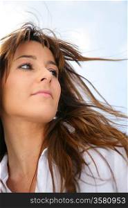 Woman&acute;s hair blowing in the breeze