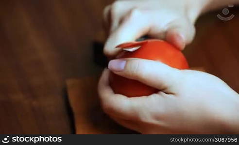 woman&acute;s hand making red rose with tomato timelapse