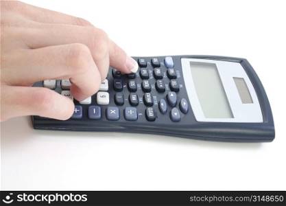 Woman&acute;s manicured hand using calculator over white.
