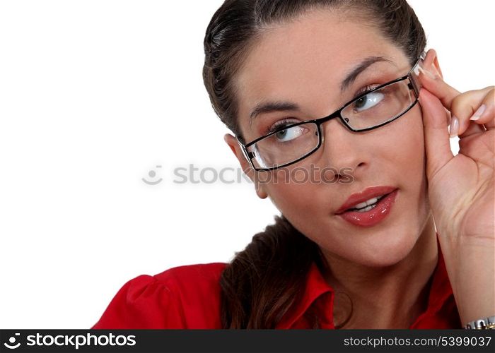 Woman adjusting her glasses