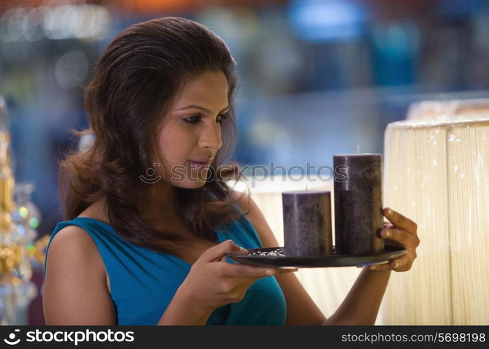 Woman admiring candles