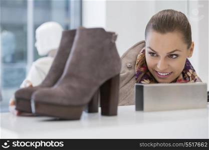 Woman admiring footwear in store