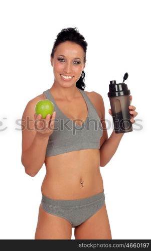 Woman after her training, drinking protein shake and with an apple in hand