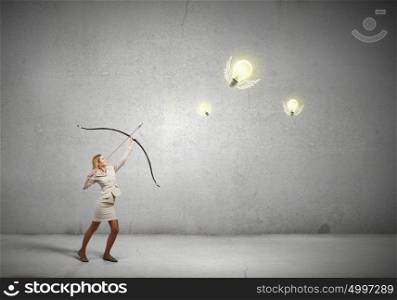 Woman aiming her goal. Young woman archer in suit aiming to idea bulb