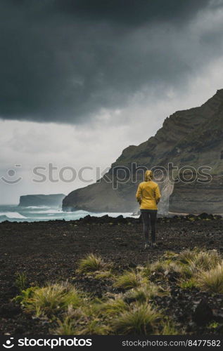 Woman alone exploring the nature in Azores Island, Portugal