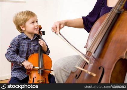 woman and boy playing Cello