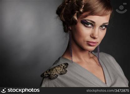 woman and butterfly on black